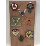 A board covered in various badges including Order of The Road.