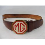 A leather belt with octagonal red and white enamel MG buckle.