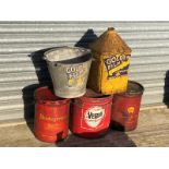 A Golden Film Oils bucket, a similar five gallon can and three grease cans.