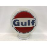 A Gulf glass petrol pump globe, the red colour repainted to both sides, otherwise in good condition.