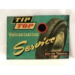 A Tip Top Vulcanization Service pictorial tin advertising sign.