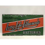 A Long Life Lithanode Batteries enamel sign with crushed glass reflective lettering.