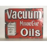 A Vacuum Motor Car Oils part pictorial double sided enamel sign by Protector of Eccles, lacking