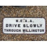 An NEAA cast iron road sign - Drive Slowly Willington, 36 x 14".