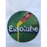 An Essolube circular double sided enamel sign depicting oil pouring from a bottle, 26" diameter.