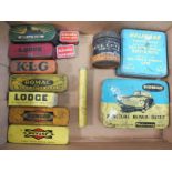 A selection of small puncture repair kit tins and spark plug tins including Sphinx.