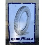 A Goodyear pictorial enamel sign depicting a tyre to the centre, 30 x 44 1/2".
