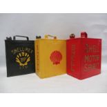 Three different Shell two gallon petrol cans.