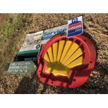 A plastic Shell sign, a wooden double sided road sign and four others.