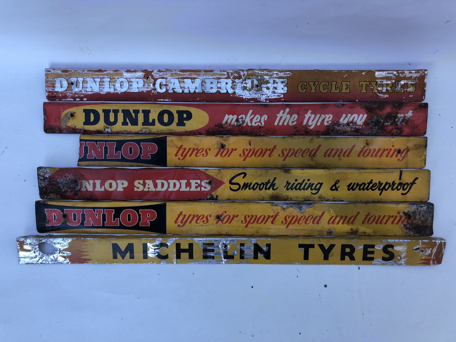 Five Dunlop shelf strips and a Michelin shelf strip.