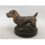 A well detailed cold painted bronze car mascot in the form of a standing dog, stamped to the base: