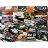 A collection of road car photographs, press paper cuttings and sketches to include press photographs