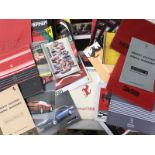A box of assorted Ferrari literature including sales brochures, promotional material, marque related