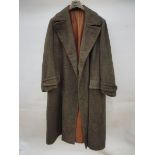 A rare and unusual gentlemans' motoring coat, heavy tweed exterior and tan leather lined, very