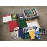 A selection of assorted literature to include workshop manuals, handbooks, a framed and glazed print