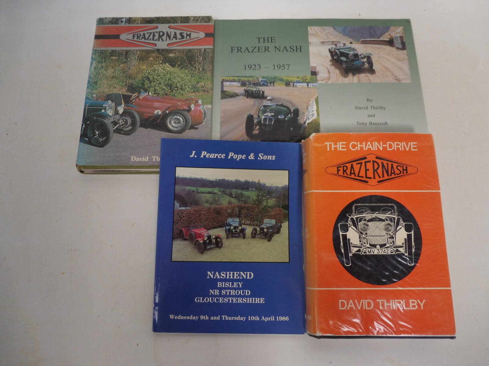 Four volumes relating to Frazer Nash including The Frazer Nash 1923-1957 by Thirlby and Bancroft,