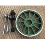 A metal rimmed and wooden spoke artillery wheel, and three horns including one bearing plaque for