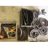 A collection of hydraulic braking components, shoes, springs, cylinders, drums and back plates