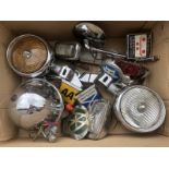 A box of lamps, spot lamps and badges etc.