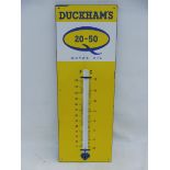 A Duckham's 20-50 enamel thermometer, 13 x 36".