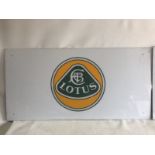 Two Lotus showroom plastic signs, each 42 x 21".