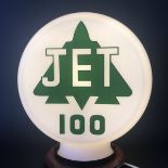 A Jet 100 glass petrol pump globe, green lettering on a pink tinted glass, very minor nibbling to