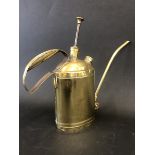 A good quality oval brass oiler with pump-action and folding slender spout.