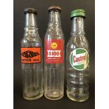 A Shell X-100 pint oil bottle and two others.