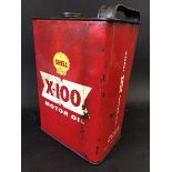 A Shell X-100 Motor Oil rectangular can.