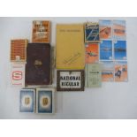 A selection of motoring ephemera including a pack of BP playing cards, an enamel brand indicator
