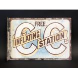 An unusual and early enamel sign advertising Free Inflating Station, a double sided sign with