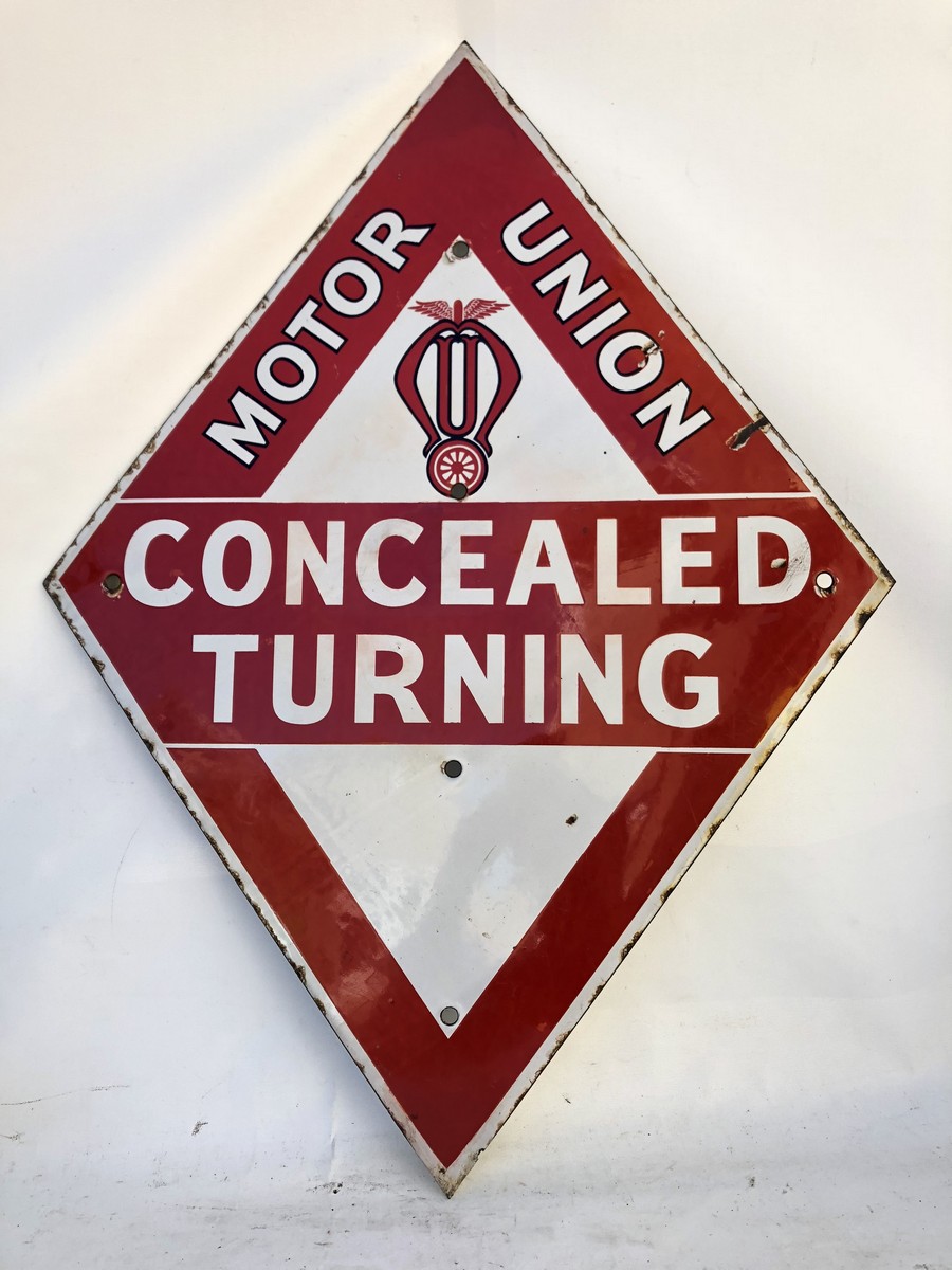 A Motor Union concealed turning lozenge shaped enamel sign of good colour, with some restoration, 22