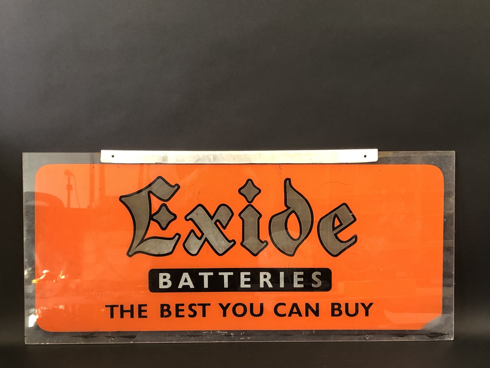 An Exide Batteries rectangular perspex advertising sign, 36 x 16".