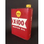 A Shell X-100 Motor Oil rectangular can.