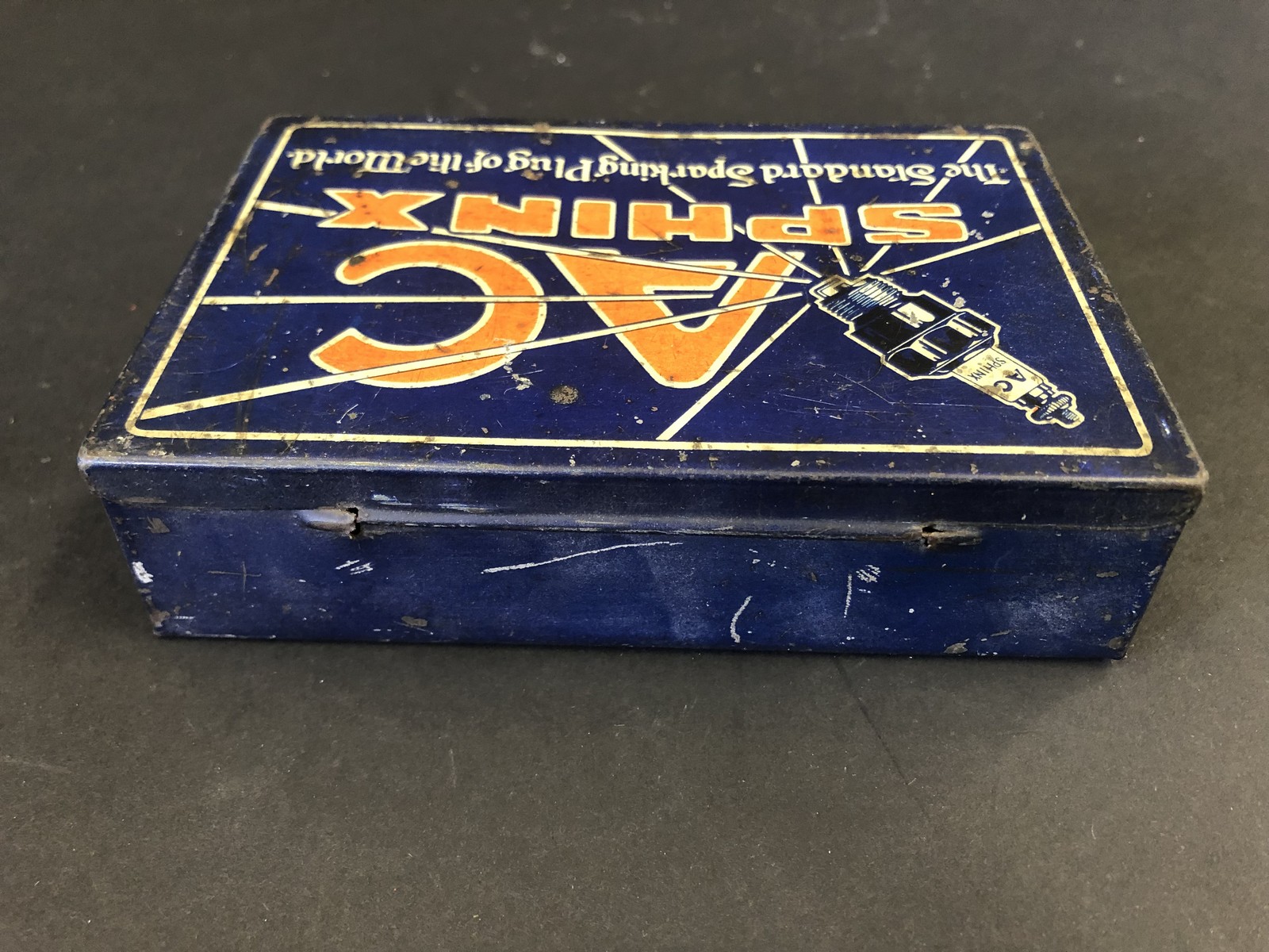 An AC Sphinx Plugs rectangular lidded tin, in good condition. - Image 2 of 2