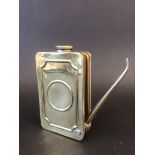 An unusual rectangular polished brass oiler with fold-out spout.