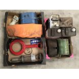 Three boxes of assorted cans, upper cylinder lubricant gun, banner etc.