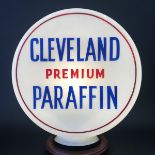A rare Cleveland circular glass petrol pump globe bearing Cleveland Premium Paraffin lettering to