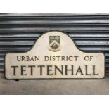 An aluminium road sign for The Urban District of Tettenhall, with metal brackets behind, 44 x 21 1/