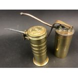 A very good quality polished brass and copper cylindrical oiler engraved R.W. Harvey and an American