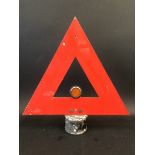 A 'Warning' triangle on a lamp post top.