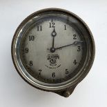 A Smiths silver faced rim-wind eight day car clock.