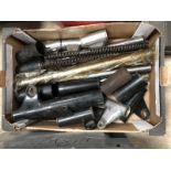 A box of motorcycle struts and covers.