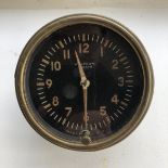 A Waltham black faced American eight day car clock.