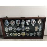 A collection of car badges to include National Automobile Club, some Continental badges, Standard