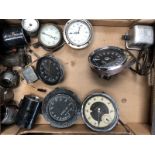 A box of assorted instruments to include a 0-80mph Austin speedometer with integral clock, and a 0-