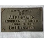 A rectangular cast metal plaque - manufactured by The Auto-Mower Engineering Co. Ltd. Norton St.