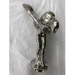 A small Rolls-Royce Spirit of Ecstasy mascot.