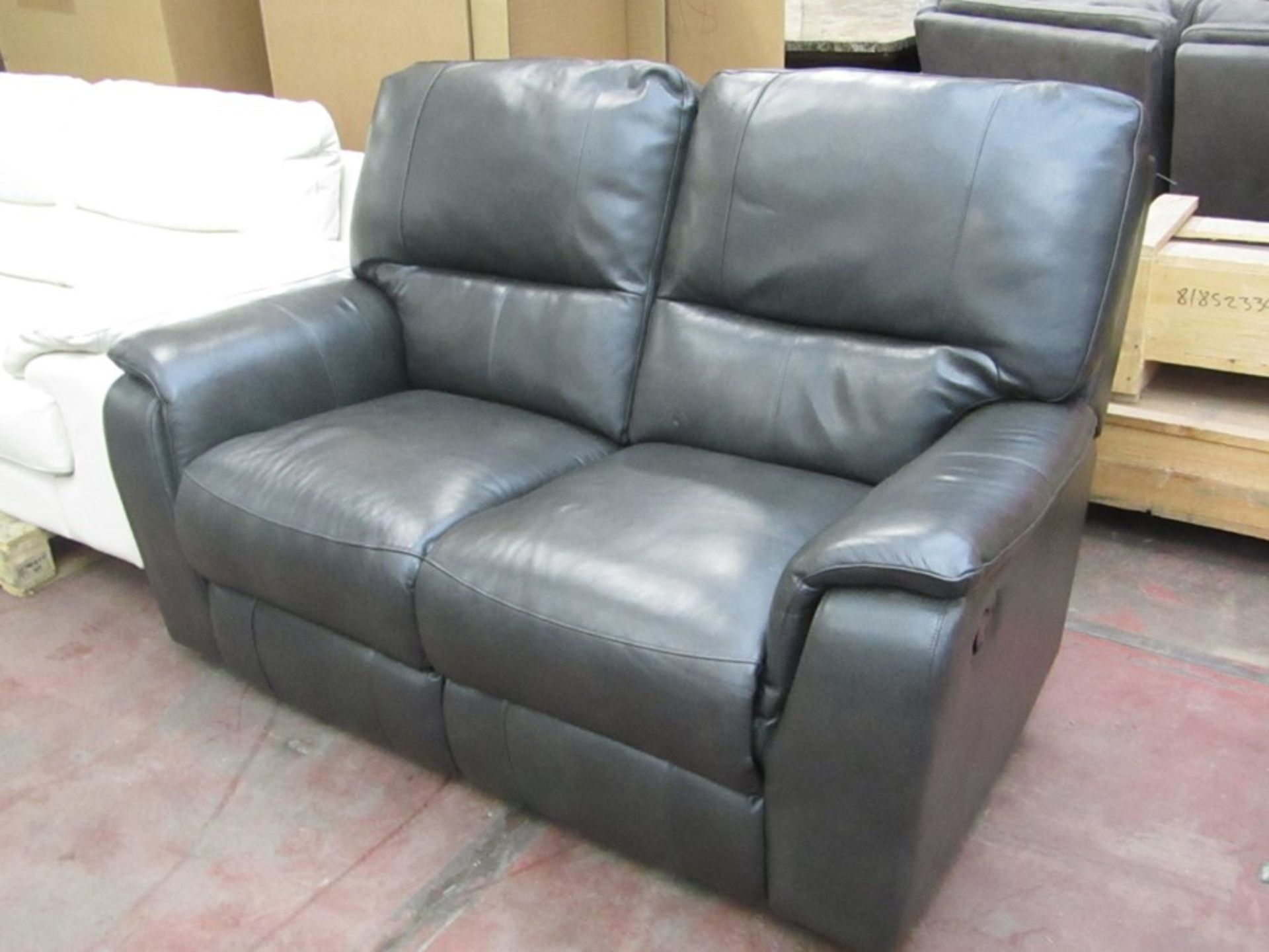 Pair of Costco brown leather reclining arm chairs, one has marks on back.