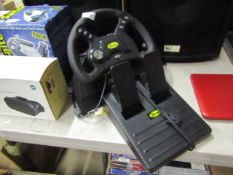 Tem Mad Catz steering wheel and pedal set, untested.